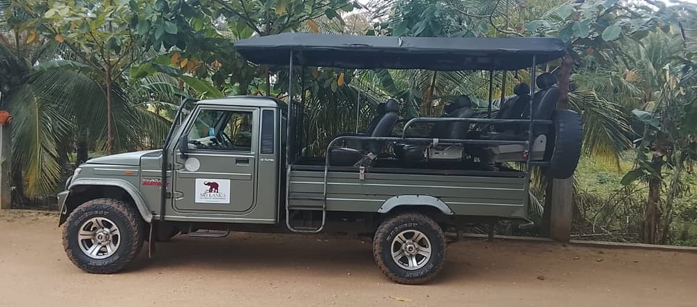 Private open-top 4WD safari jeep with raised seats and a canvas roof, used for Udawalawe and Yala safaris